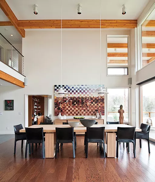 Leonel Luna’s digital print La Conquista Perptetua, which the couple picked while traveling in Mexico, graces the main wall of the dining room.