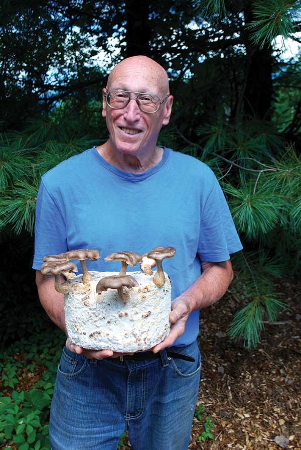 Marc Eisenson with shiitake mushroom kit.