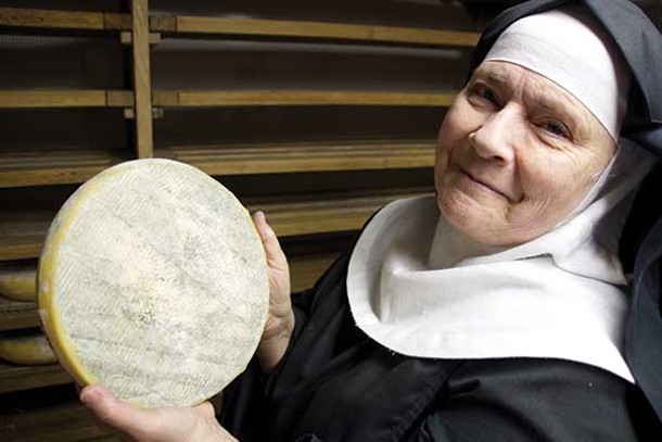 Mother Noella Marcellino in the aging room, holding a wheel of Bethlehem. - PETER BARRETT