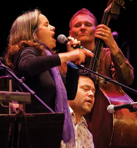 Natalie Merchant, Daniel Littleton, and Chris Wood (on bass) performing at the Shelter from the Storm concert at UPAC on November 18. The concert raised $100,000 for victims of Hurricane Irene. - JOHN DESANTO/TIMES-HERALD RECORD