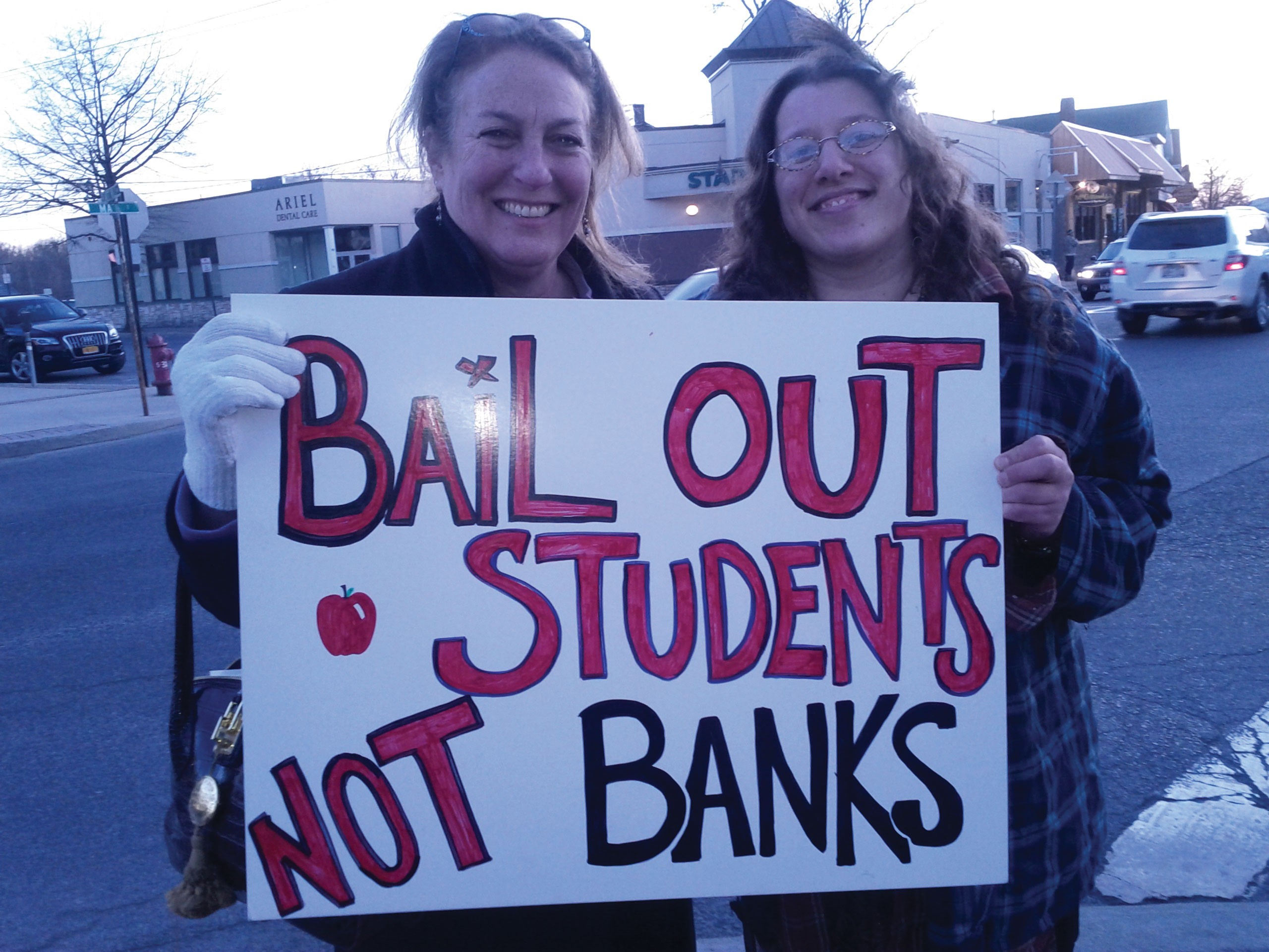 New Paltz Town Supervisor Susan Zimet and Amanda Sissenstein of Occupy New Paltz at the #Occupy Education March and Rally in downtown New Paltz on March 10. Photo: Michelle Ridell.