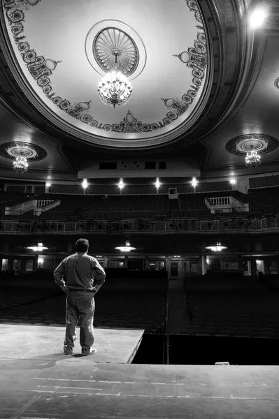 Peter Hughes, advertising manager of Proctor’s, surveys the renovated theater. - HILLARY HARVEY
