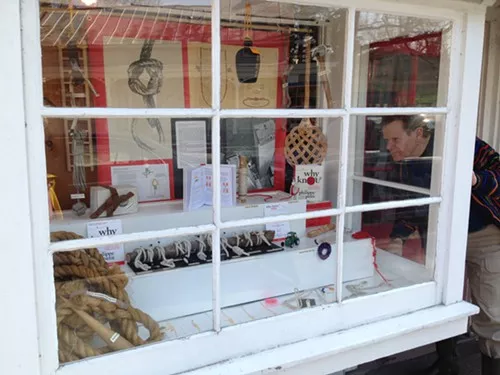 Philippe Petit examines the Why Knot? window display Philippe Petit examines the Why Knot? window display