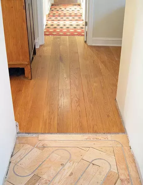 Radiant heating system by John Abularrage of Advanced Radiant Design in Stone Ridge, installed on top of a plywood sub-floor with a finished wood floor above.