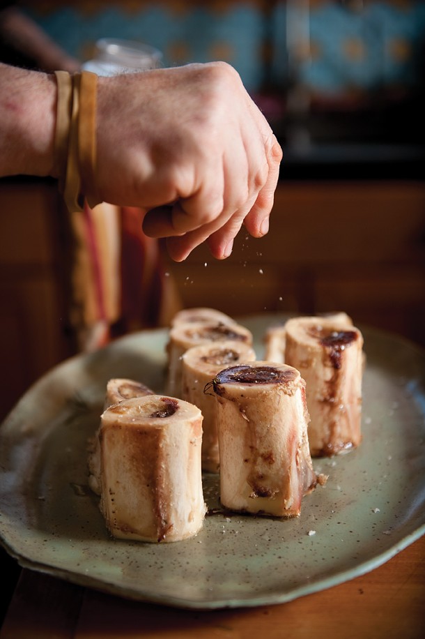 Chef Rich Reeve, formerly of Elephant in Kingston, salting the roasted marrow before serving. - JENNIFER MAY