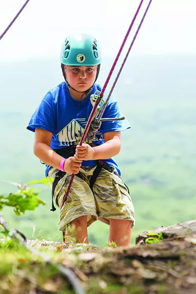 Rock climber Duncan Spatz repels down the cliff at Mohonk Preserve in Gardiner. - THOMAS SMITH