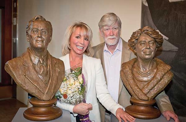 Sculptor Carolyn Palmer and David Roosevelt pose next to Palmer's new sculptures of Franklin and Eleanor at the FDR Presidential Library and Museum. - ERIC ANTHONY JOHNSON