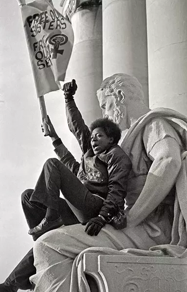 sl_shes_1367blaisdell_womanonstatue.jpg