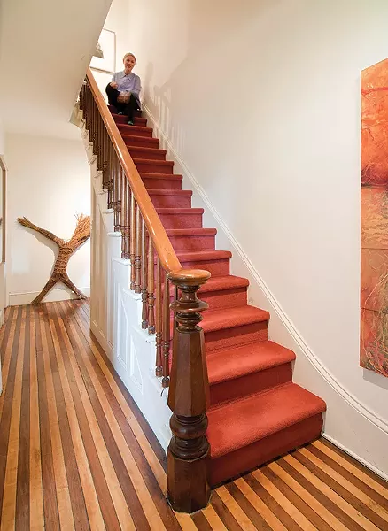 The entry floor is original, with boards of maple and black walnut.