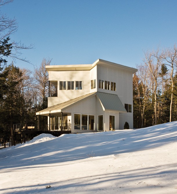 The main facade of the house faces full sun and the forest instead of the driveway. The siding from Hardie Panel is energy efficient and low maintenance. - DEBORAH DEGRAFFENREID