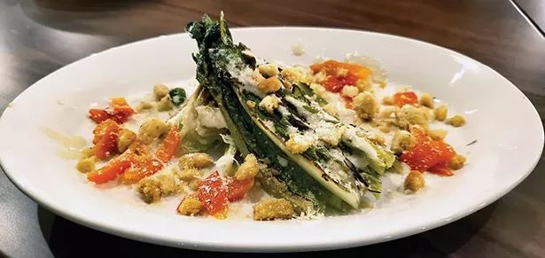Grilled romaine with anchovy vinaigrette, roasted pepper, garlic crouton.