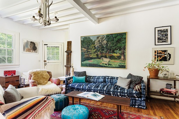 The living room features a painting by Letizia Pitigliani over the couch, prints by Robert Angeloch over the bar cart (a family heirloom), and Simi Stone’s Aubergine is on - the far wall. - PHOTO: WINONA BARTON-BALLENTINE