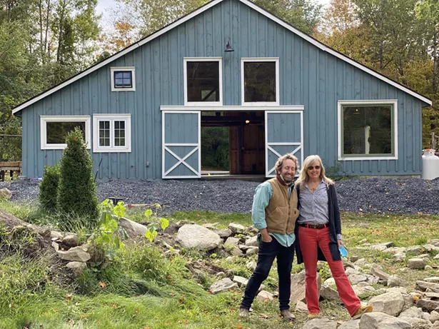 Lindsey and FireDean in front of the Dutchess County barn that serves as their shared creative space