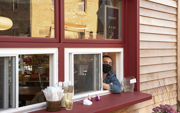 Co-owner Anna Morris at Kitty's takeout window. - SABRINA EBERHARD
