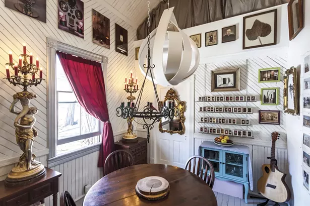 The home’s dining room is filled with Lalala’s art and found treasures. By combining - photography, sketching, painting, sculpture, and found art, she’s created a diverse body of intricate work “comprised of spiritual, social, and psychological investigations.” - WINONA BARTON-BALLENTINE