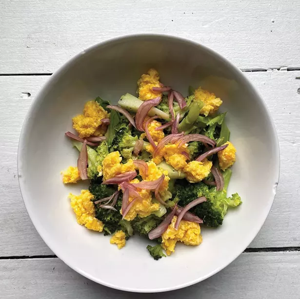 Garlicky egg sauce: leftover scrambled egg pounded with garlic and olive oil and spooned over vegetables, topped with quick pickled onions.