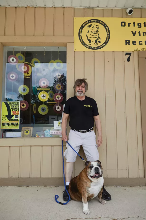 Original Vinyl Records specializes in new and used vinyl records, 45s, 78s, cassettes, 8-tracks, and music memorabilia. Co-owner Jim Eigo is pictured with Diesel, the store’s mascot. - DAVID MCINTYRE
