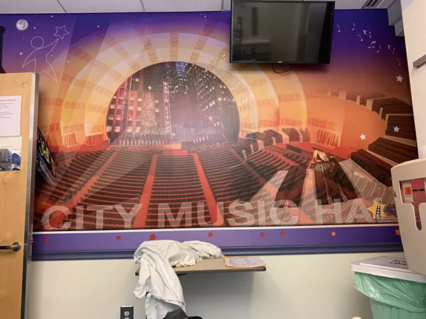 Inside the ER at Westchester Medical Center there's a special treatment room with a mural of Radio City Music Hall—which was strangely comforting. But where were the Rockettes? This photo was taken by the author from his bed on July 9 at 11:30pm.
