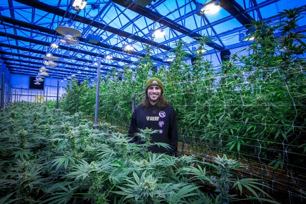 Eric Moskowitz, Director of Operations at The Pass stands in one of its greenhouses - PHOTO BY GOOD BITES & GLASS PINTS™