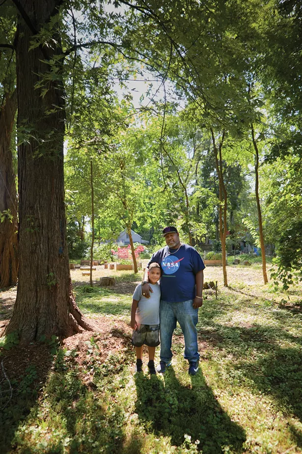 Harambee founder Tyrone Wilson with his son Jayden at the Pine Street African Burial Ground. - DAVID MCINTYRE