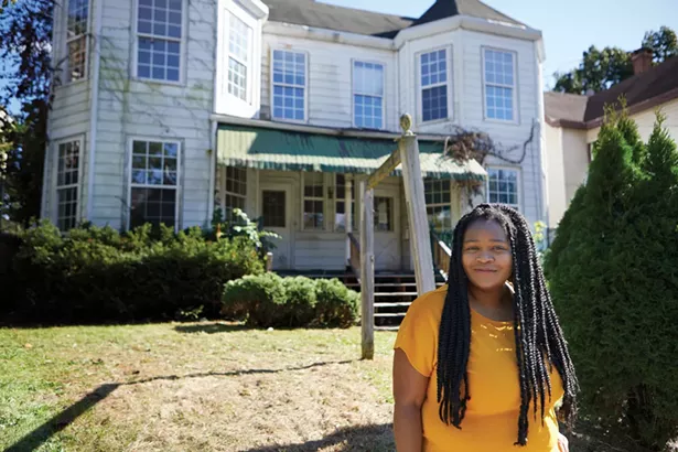 Rashida Tyler of the Real Kingston Tenants Union and Ulster County Coalition for Housing Justice in front of a house on Henry Street owned by the City of Kingston that has been vacant for three years. - DAVID MCINTYRE