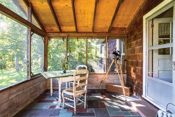 Salvemini enjoys the home’s covered back porch throughout the warmer months with views to her back acreage. “The property feels both pastoral and wild to me,” she explains. “I think I’ve been trying to give myself a chance to be a dirty-faced, barefoot, little girl in adulthood. I feel safe exploring that here.” - WINONA BARTON-BALLENTINE