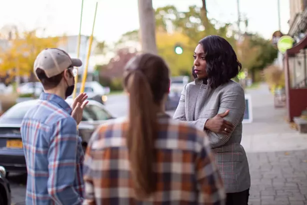 Uncharted Power's CEO Jessica O. Matthews speaks with Poughkeepsie residents on the street. - COURTESY OF UNCHARTED POWER