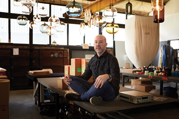 Jeremy Pyle, founder and creative director of Niche Modern, in the boutique lighting company’s headquarters on Fishkill Avenue. - DAVID MCINTYRE