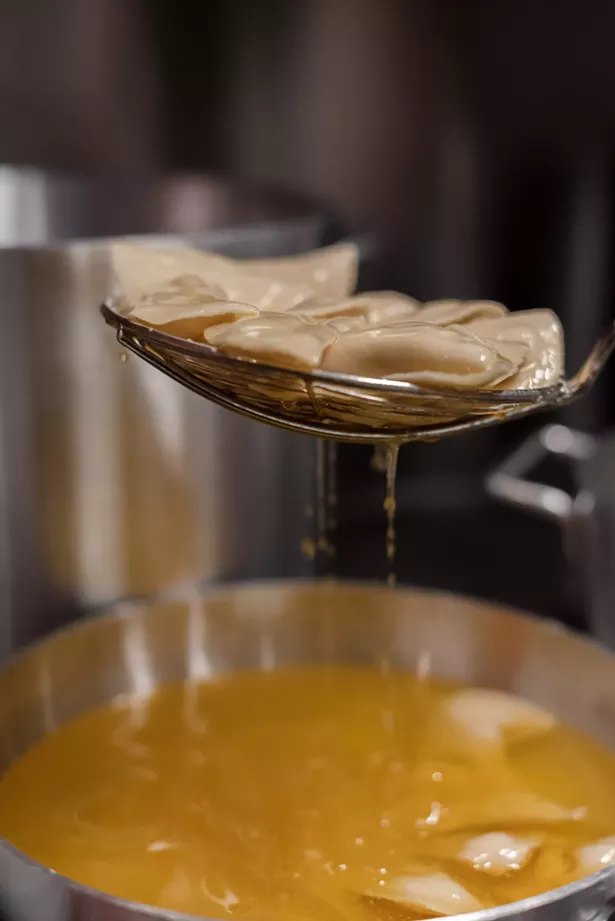 Per the Krupa's grandmother's family recipe, the pirogies are dipped in melted butter before being frozen. - SHEENA XAYASOUK PHOTOGRAPHY