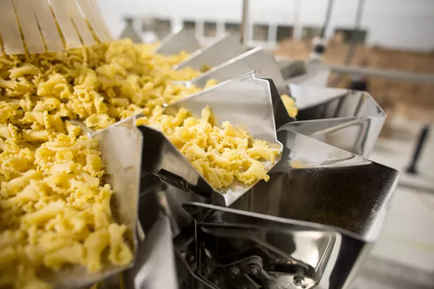Sfoglini trumpets are weighed before being portioned into boxes below. - IMAGES COURTESY OF SFOGLINI