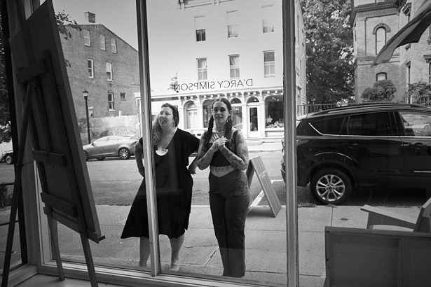 Gallerist Ellen D’Arcy Simpson and artist and musician Emily Ritz in front of D’Arcy Simpson Art Works, where Ritz’s work is on display through September 10. - DAVID MCINTYRE