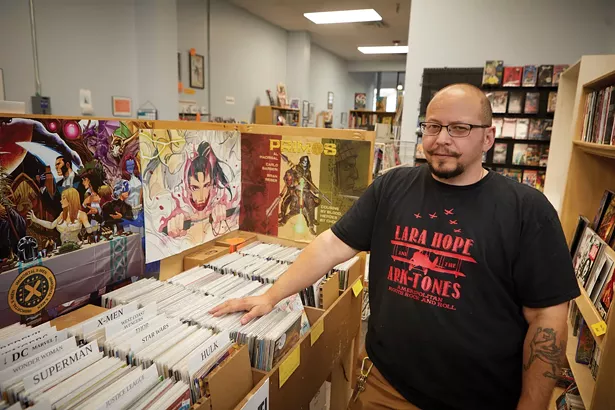 Cristopher Livecchi inside his shop World's End Comics - DAVID MCINTYRE