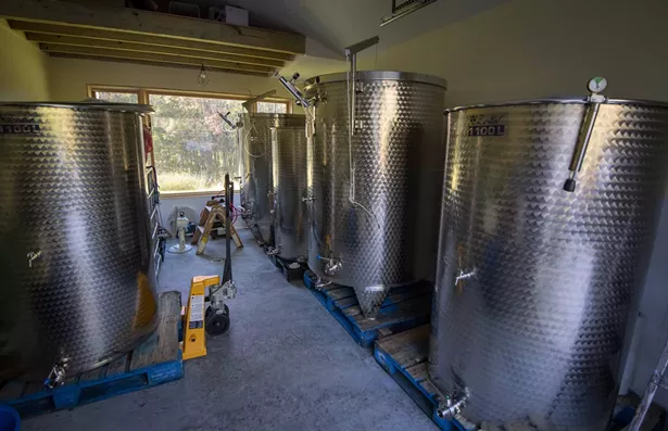 The stainless steel fermentation tanks.