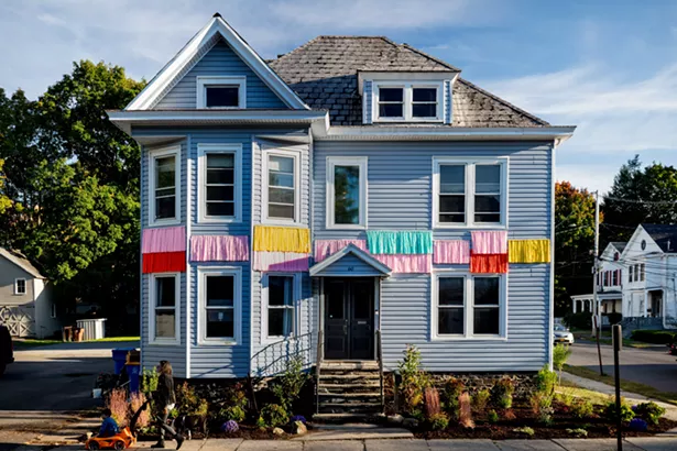 The house's exterior fringe work was done by Chris Bick and Buddy Valentine. - PHIL MANSFIELD