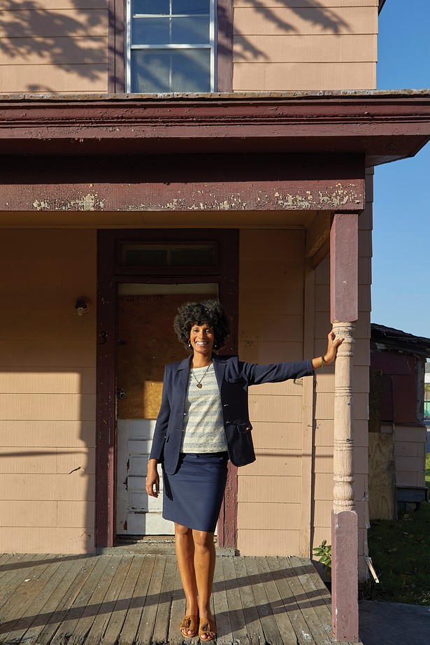 Esi Lewis on the porch of the Ann Oliver House, built in 1885 by Black architect Jacob Wynkoop. Lewis is the founder of the Dr. Margaret Wade-Lewis Black History Research and Cultural Center, which the building will eventually house. - DAVID MCINTYRE