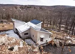 Situated on a south-facing slope, the home was built to take full advantage of seasonal light and is powered by solar panels. A geothermal heating and cooling system regulates the home's temperature throughout the year. - DEBORAH DEGRAFFENREID