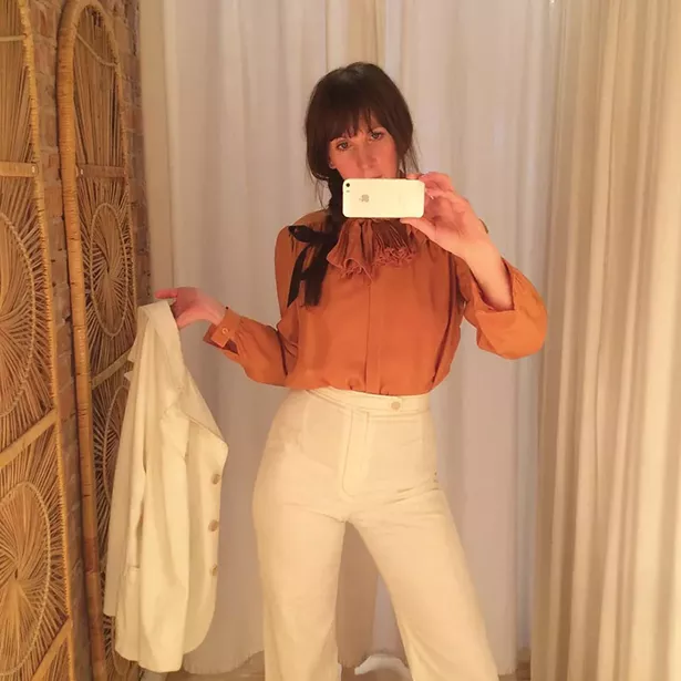 Darbie wears a 1980s Valentino silk blouse and 1970s white cotton pantsuit all from Lovefield Vintage in Kingston.