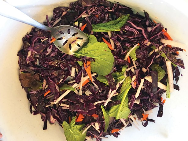 Shreds of crunchy red cabbage are mixed with daikon, carrots, and mustard greens to create a distinctive kimchi. - JOAN MACDONALD