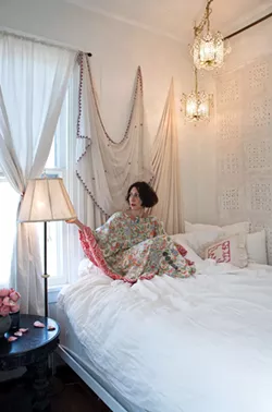 Khorramian in her downstairs bedroom wearing another of her silk “kaftoons.” - DEBORAH DEGRAFFENREID