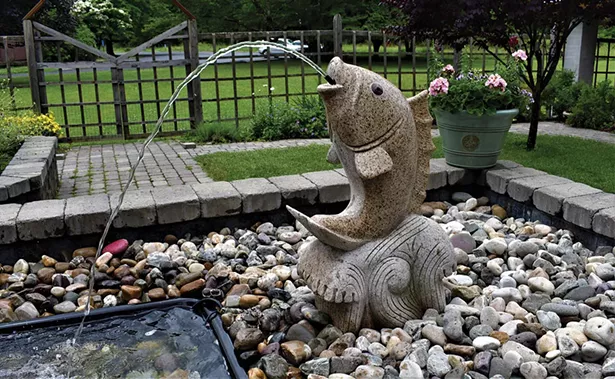 The soothing sounds of the fish fountain permeate St. Gregory’s Horticultural Therapy Garden. - LARRY DECKER