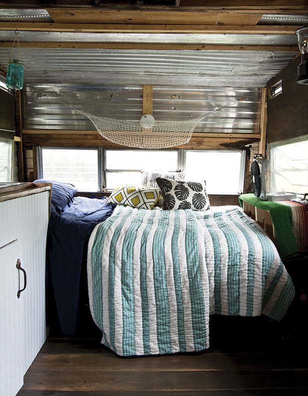 The couple’s trailer bedroom. The interior of both structures was restored with scavenged and recycled materials, including metal and wood from the property’s razed house. - DEBORAH DEGRAFFENREID