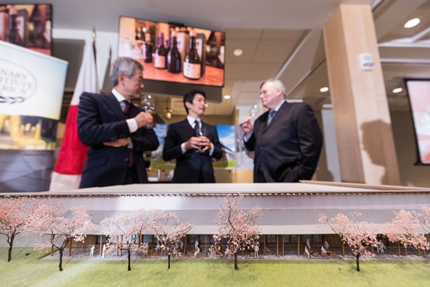 CIA President Dr. Tim Ryan (right), Asahi Shuzo President Kazuhiro Sakurai, and Chairman Hiroshi Sakurai talking about the sake education partnership between The Culinary Institute of America and Asahi Shuzo on April 10, 2018. In the foreground is a scale model of Asahi Shuzo’s new brewery to be built in Hyde Park, NY. - PHOTO CREDIT: CIA/PHIL MANSFIELD