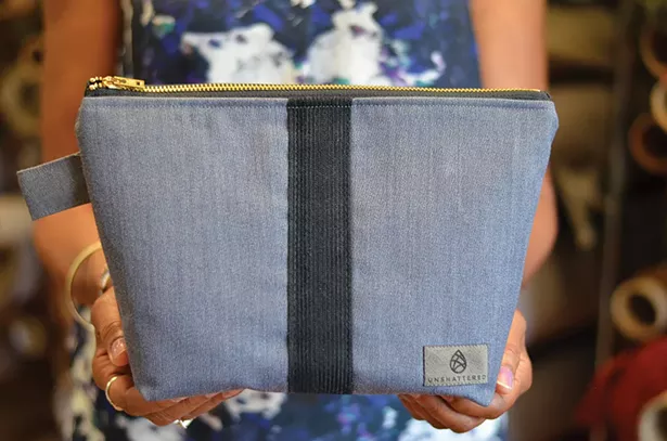 A makeup kit made from an upcycled West Point cadet uniform.