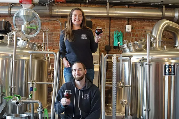 Cortlandt Toczylowski, owner and headbrewer, and Caroline Bergelin, owner, graphics and sales, at King’s Court Brewing Company. - PHOTO BY JOHN GARAY