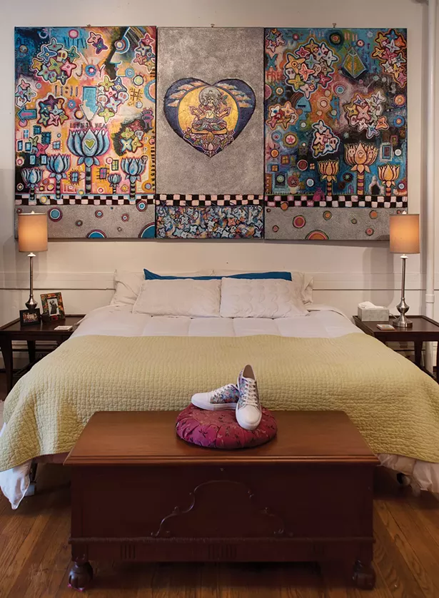 Bickman’s bedroom is decorated with her grandmother’s hope chest and some of her work. Her shoes are painted with the cherry blossom motif which, along with skulls, reoccurs throughout her fine art. “The skulls represent impermanence; the blossoms represent new life.” - PHOTO BY DEBORAH DEGRAFFENREID