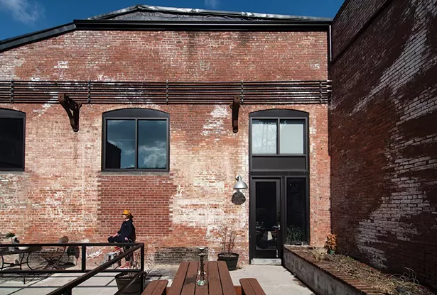 Robin Rice’s loft is one of 200 renovated spaces in The Lofts at Beacon created from a 19th-century textile mill. Right next to the Fishkill Creek’s dam and waterfall, the live/work spaces incorporate many of the original industrial features and enjoy multiple community spaces both indoor and out. - PHOTO: DEBORAH DEGRAFFENREID