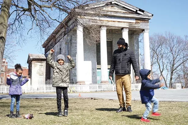 Carmela, Zach Jr., Giovanni, and Zachary Murry in front of the Dutch Reformed Church on Grand Street. - PHOTO: JOHN GARAY