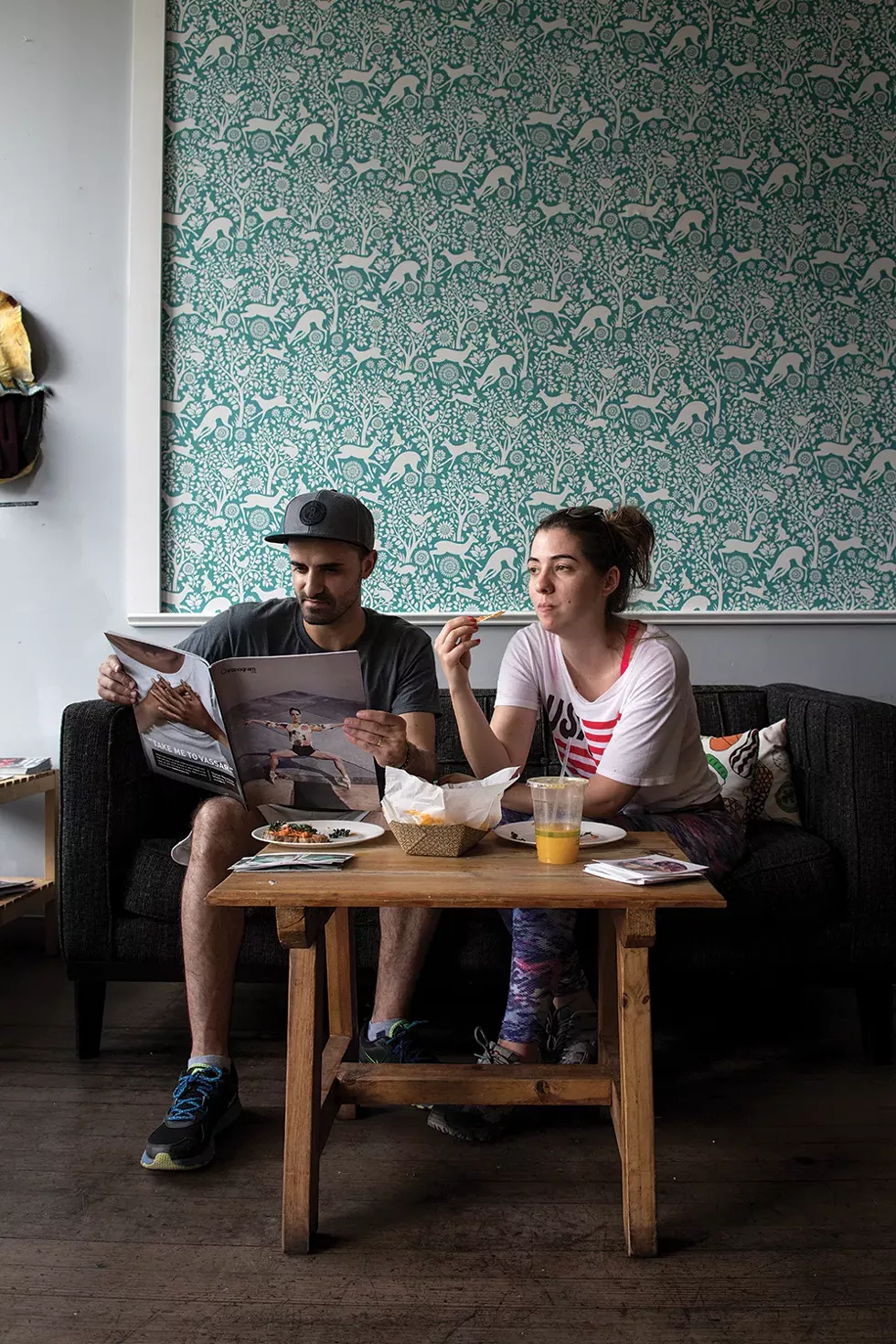 Sandro Figueiredo and Joana Martins enjoying Chronogram and lunch at Conscious Fork. - PHOTO: CHRISTINE ASHBURN