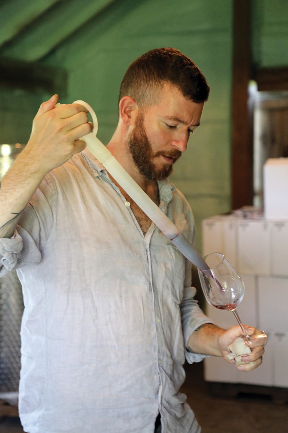 Using a thief to barrel-taste wines ready for bottling. - PHOTO: PETER BARRETT