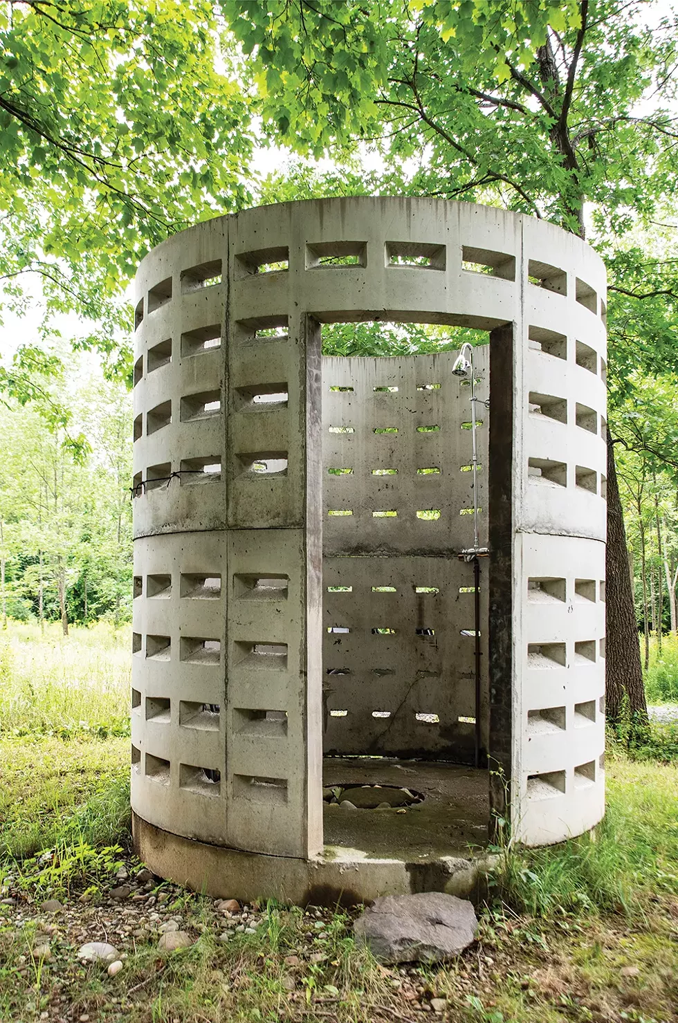 To create an innovative outdoor shower, the couple bought two septic dry wells from local concrete supplier Keeler Vault, stacked them and installed plumbing. “At first they said, ‘You want to do what with the septic wells?’ But now everyone gets it,” says Betts. - PHOTO: DEBORAH DEGRAFFENREID
